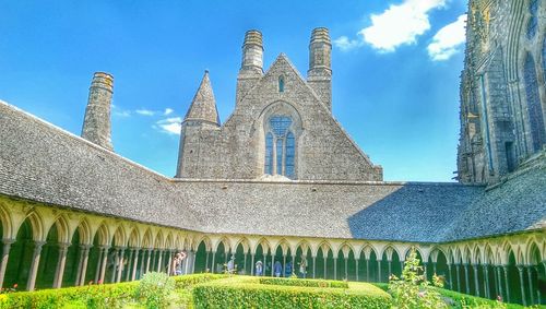 Low angle view of built structure against blue sky