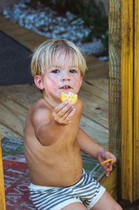 Full length of boy eating food