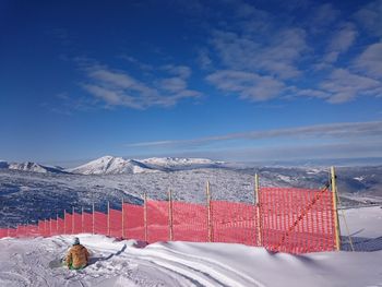 Scenic view of snow mountains against blue sky