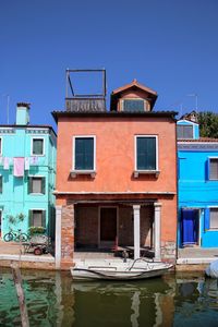 Houses against clear blue sky