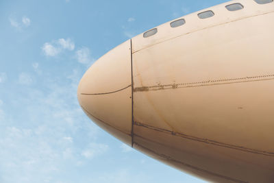 Low angle view of airplane against sky