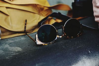 Close-up of sunglasses on table