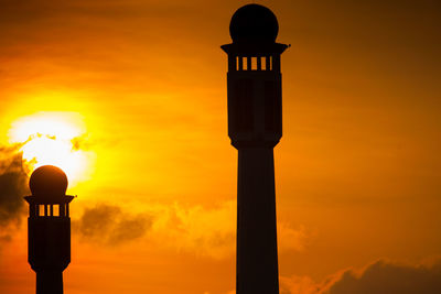 Low angle view of street light against orange sky