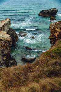 High angle view of rocks in sea