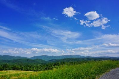 Scenic view of landscape against cloudy sky