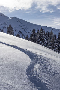 Scenic view of snowcapped mountains against sky