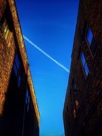 Low angle view of building against blue sky