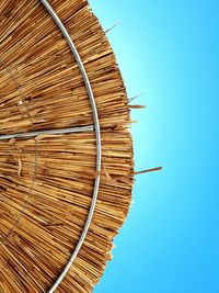 Low angle view of spiral staircase against clear blue sky