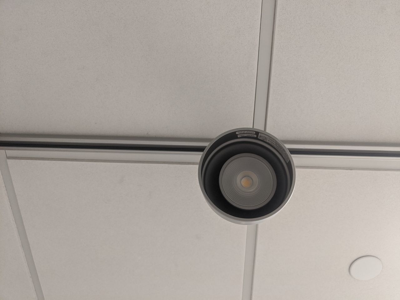 LOW ANGLE VIEW OF ELECTRIC LIGHT ON CEILING