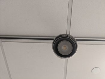 Low angle view of electric light on wall