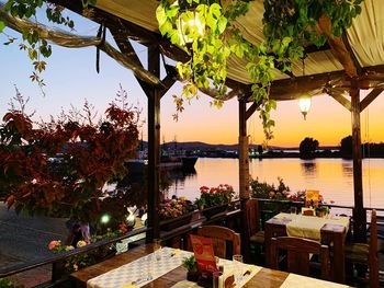 View of swimming pool in restaurant at sunset