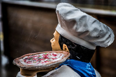 Rear view of person holding ice cream