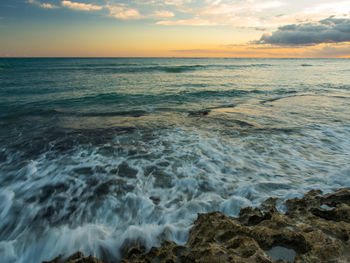 View of calm sea at sunset