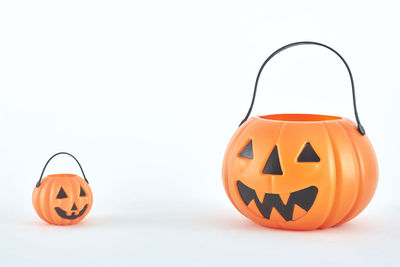 Close-up of pumpkin against orange background