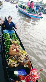 Woman standing in boat