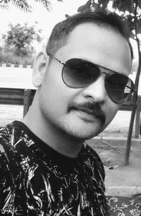 Portrait of young man wearing sunglasses