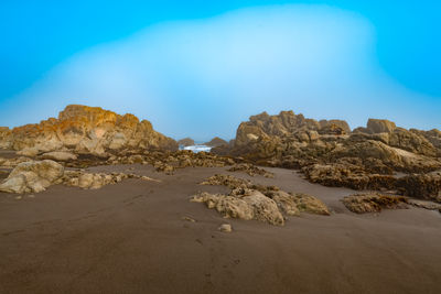 Scenic view of desert against clear sky