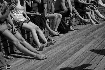 Low section of women sitting on floor