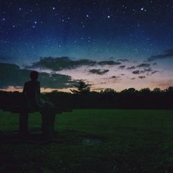 Scenic view of landscape against sky at dusk