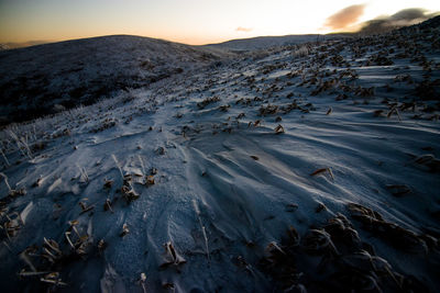 Scenic view of snow covered mountains against sky