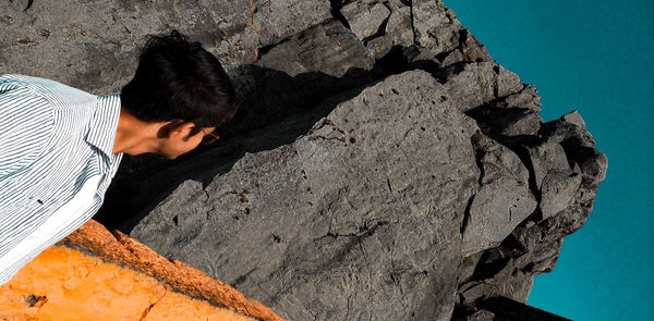 Rear view of man on rock