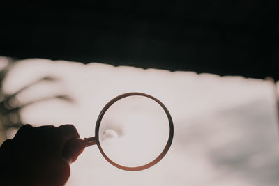 Close-up of hand holding crystal ball