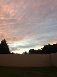 Silhouette trees against sky during sunset