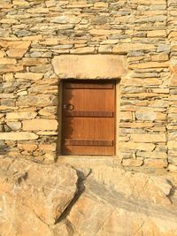 Closed window on brick wall