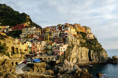 Panoramic shot of townscape by sea against sky