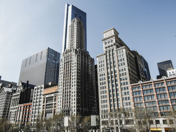 Low angle view of skyscrapers against sky