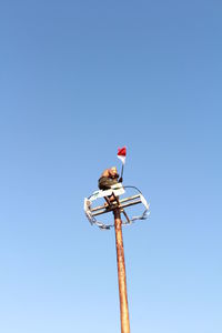 Low angle view of a pole against the sky