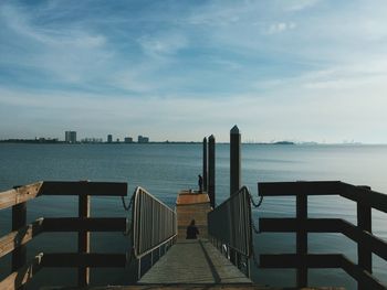Pier over sea against sky