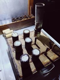 High angle view of candles on table at temple