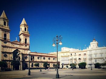 View of buildings against blue sky