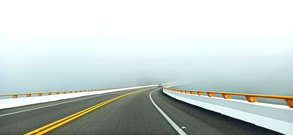 View of road on bridge against sky