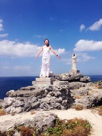 Woman standing on rocks