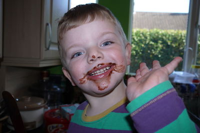 Close-up portrait of boy at home