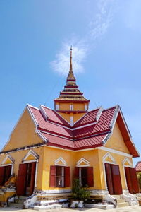 Low angle view of building against blue sky