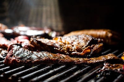 Close-up of meat on barbecue grill