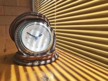 High angle view of clock on table