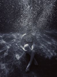 Woman swimming in swimming pool