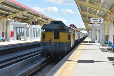 Train on railroad station platform against sky