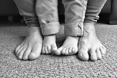 Mother holding baby hands