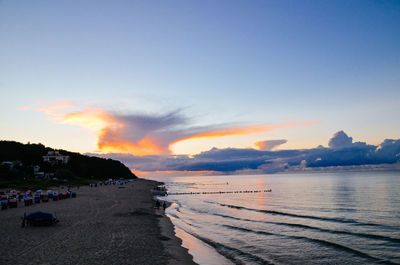 View of calm beach against blue sky