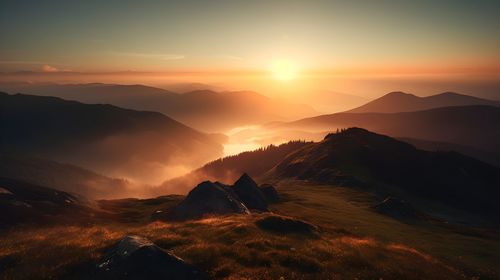 Scenic view of mountains against sky during sunset