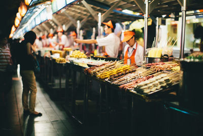 People at market stall