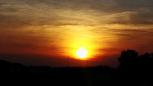 Scenic view of silhouette landscape against romantic sky at sunset