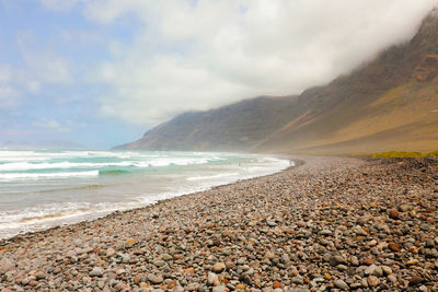 Scenic view of beach against sky