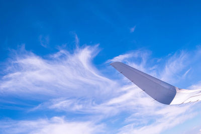 Low angle view of airplane flying in sky