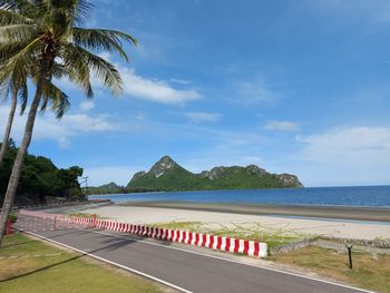 Scenic view of swimming pool by sea against sky